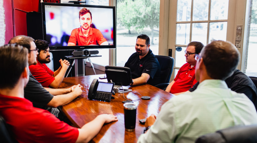 A group of people in a video conference
