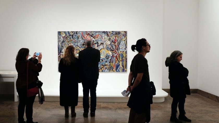 people observing art at an art gallery